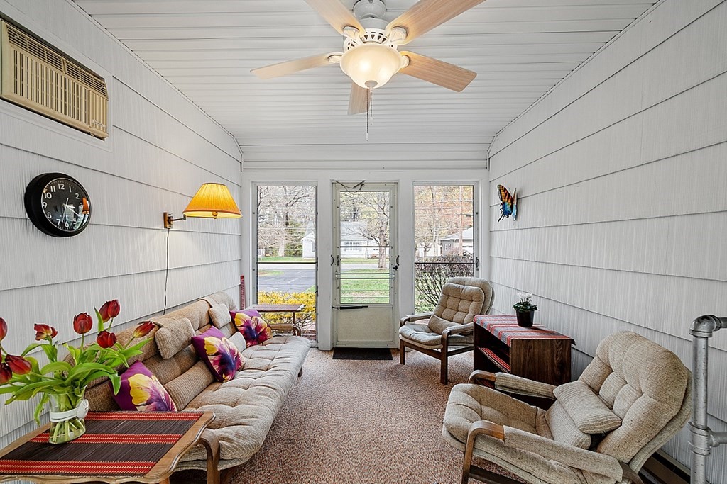 61 Harvard Road Shirley, MA 01464 - Photo 4 of 42 a living room with furniture and a chandelier