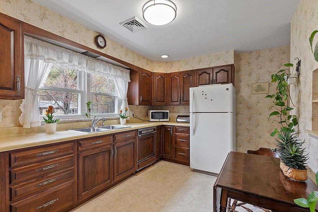 61 Harvard Road Shirley, MA 01464 - Photo 5 of 42 a kitchen with sink cabinets and refrigerator