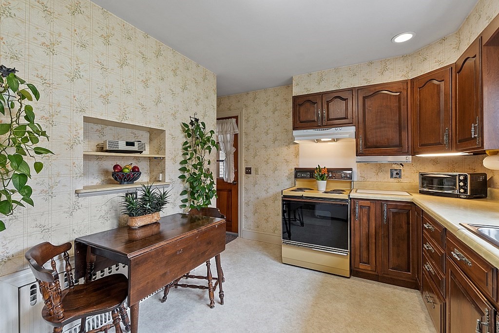 61 Harvard Road Shirley, MA 01464 - Photo 6 of 42 a kitchen with stainless steel appliances a stove a sink and a refrigerator