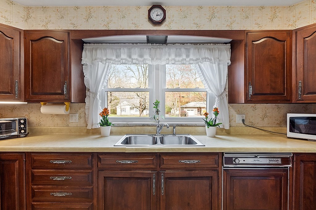 61 Harvard Road Shirley, MA 01464 - Photo 7 of 42 a kitchen with a sink and cabinets