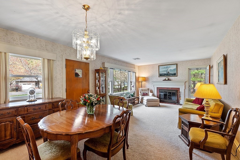 61 Harvard Road Shirley, MA 01464 - Photo 10 of 42 a living room with furniture a chandelier and a dining room