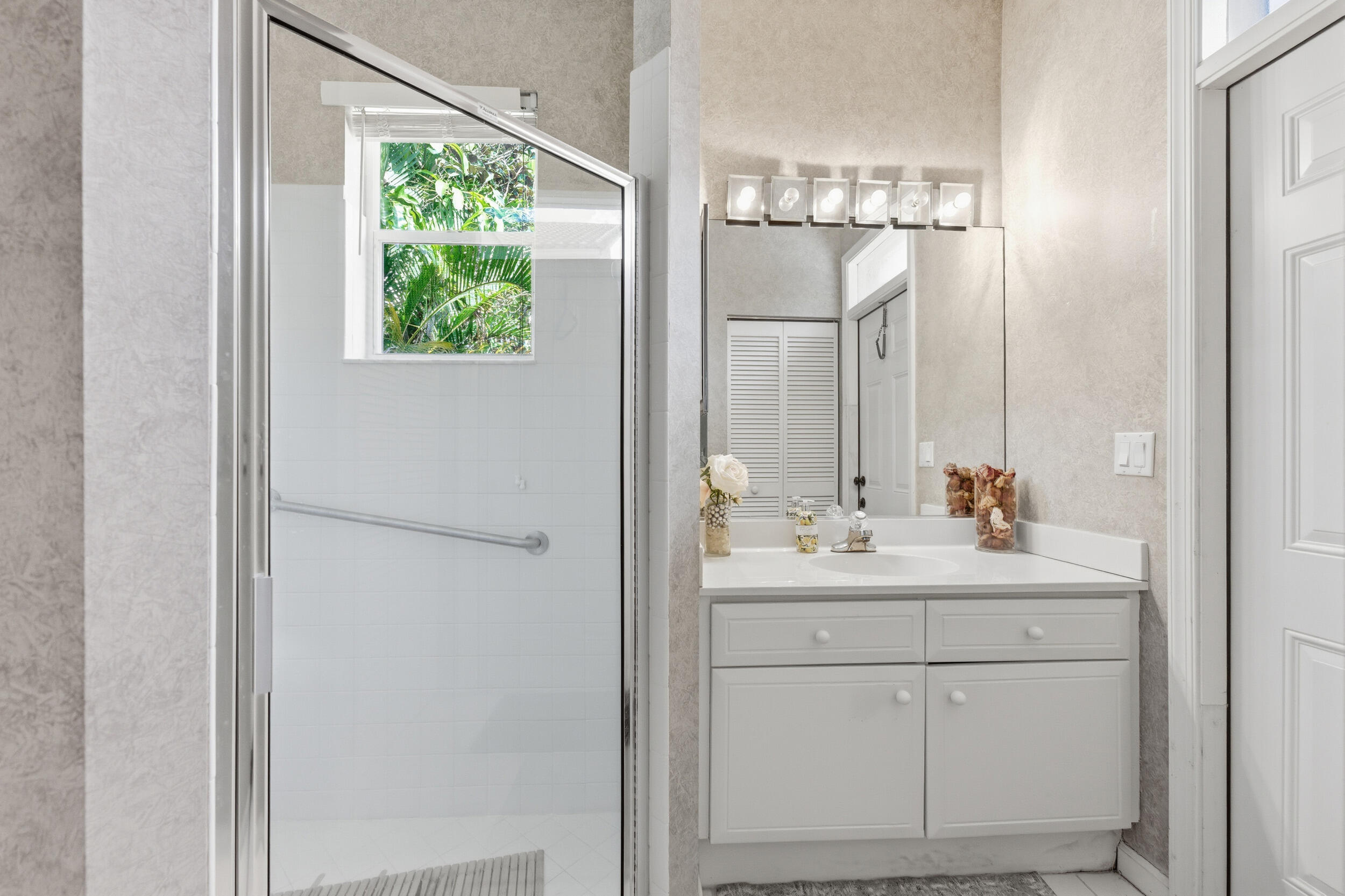 2495 Northwest 66th Drive Boca Raton, FL 33496 - Photo 19 of 74 a bathroom with a double vanity sink and mirror