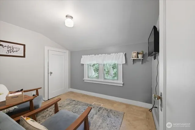 a room with furniture and a window