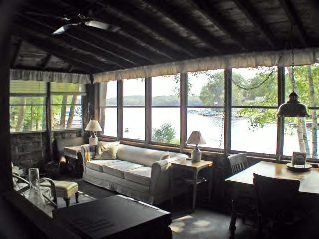 122 Kibbe Road Otis, MA 01029 - Photo 8 of 8 a living room with furniture large windows and wooden floor