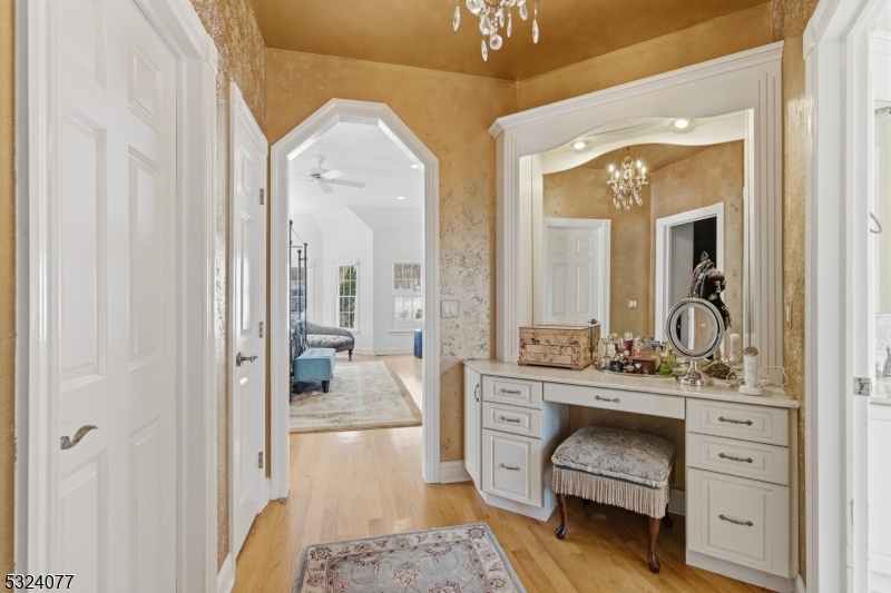 4 Deer Trail Road Saddle River, NJ 07458 - Photo 13 of 37 a en suite bathroom with a double vanity sink a mirror and a shower