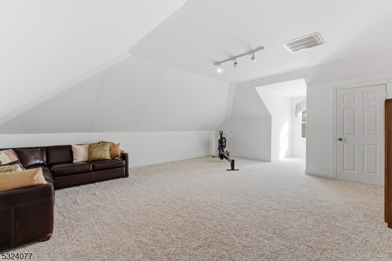 4 Deer Trail Road Saddle River, NJ 07458 - Photo 24 of 37 a view of an empty room with a couch