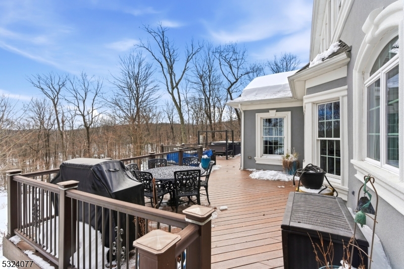 4 Deer Trail Road Saddle River, NJ 07458 - Photo 32 of 37 a view of a patio with table and chairs and wooden floor