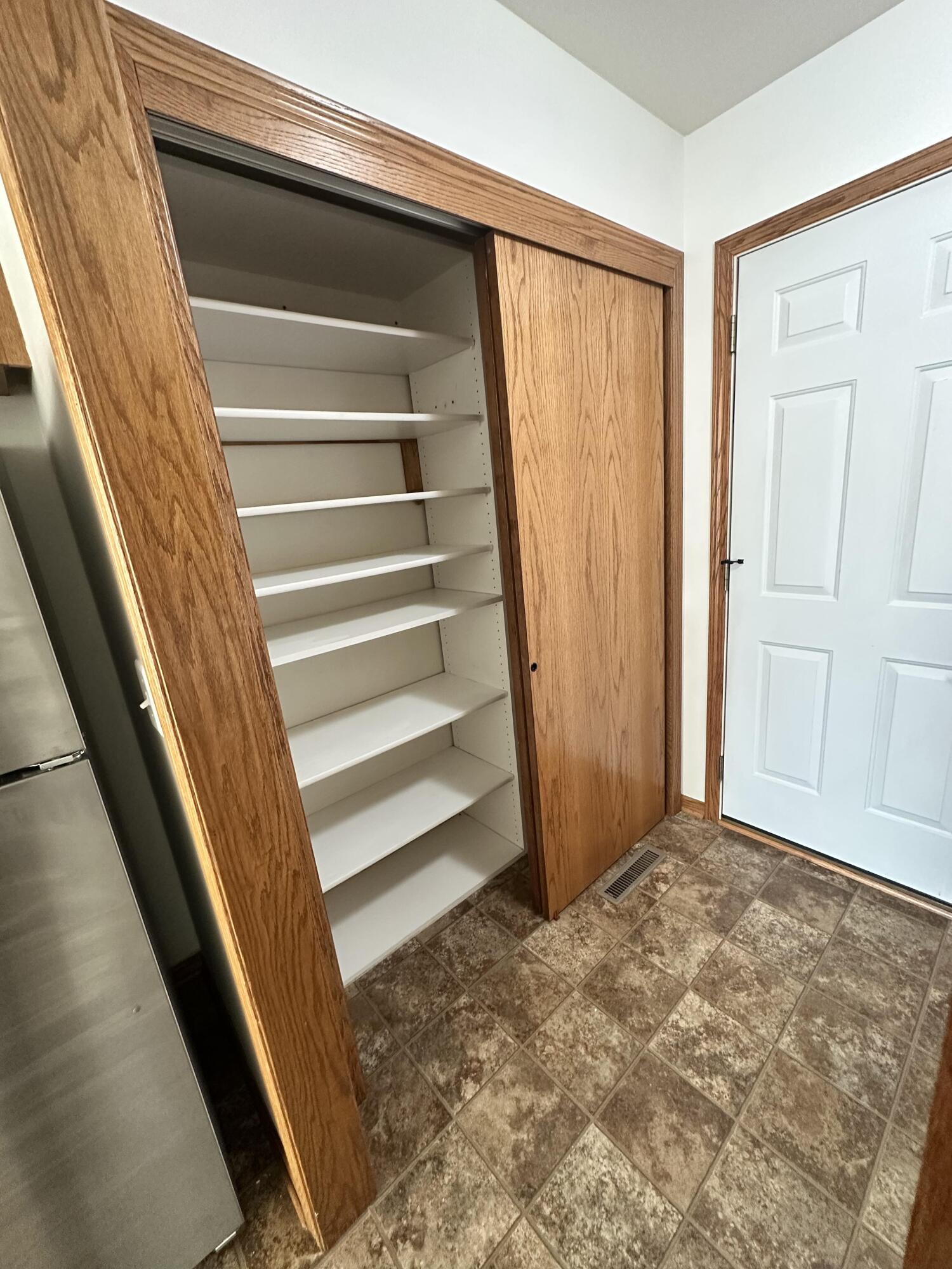 1133 Ellys Way Slinger, WI 53086 - Photo 27 of 35 Robert McCaigue - 1135 - Laundry Pantry
