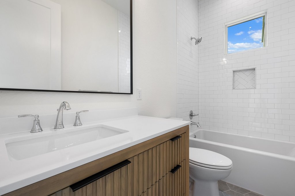 501 Ranchview Drive Johnson City, TX 78636 - Photo 17 of 28 a bathroom with a sink a toilet and shower