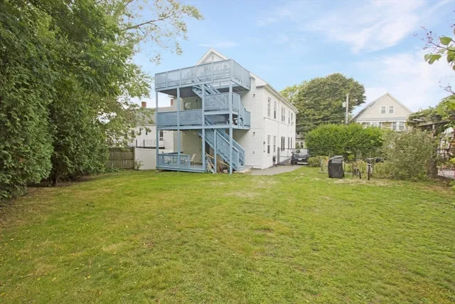 a front view of a house with a big yard