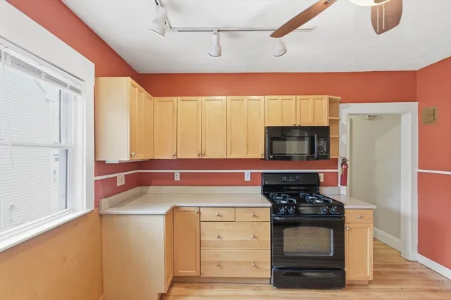 a kitchen with stainless steel appliances a stove and a refrigerator