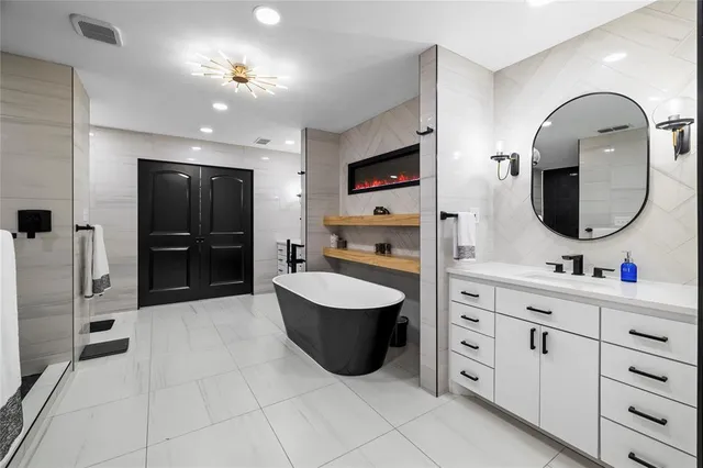 a spacious bedroom with a bed and a couch