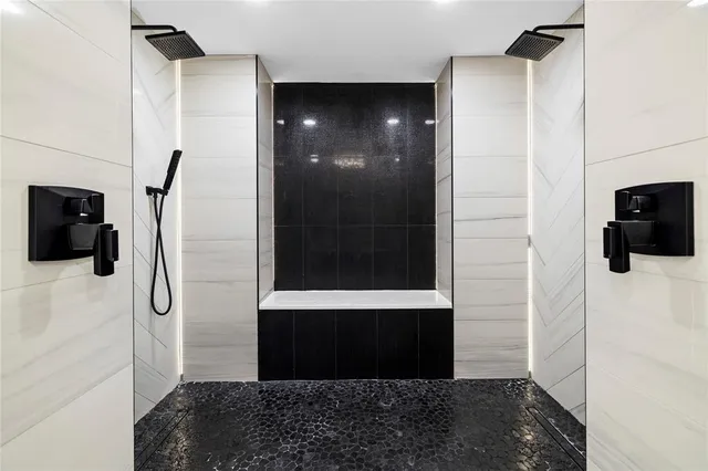 a spacious bathroom with a sink a toilet and a mirror