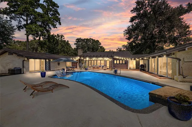 a view of a swimming pool with lounge chair