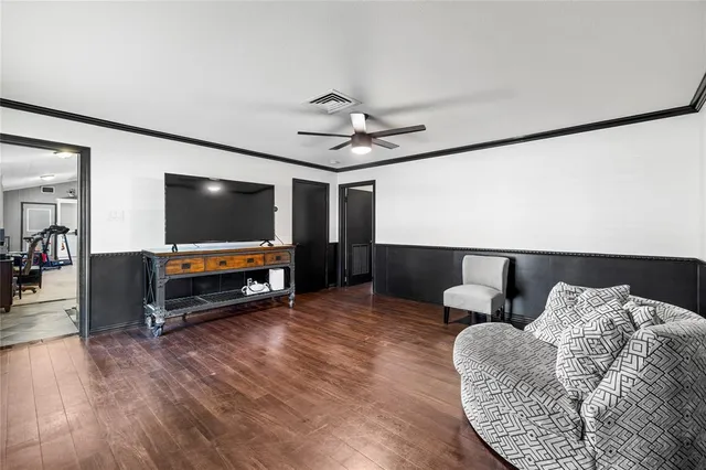a bedroom with a bed and large glass window