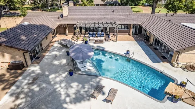 a view of a backyard with sitting area