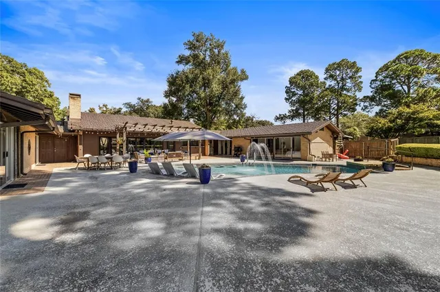 a view of a backyard with sitting area