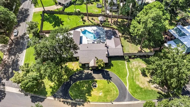 a view of a house with backyard space and sitting area