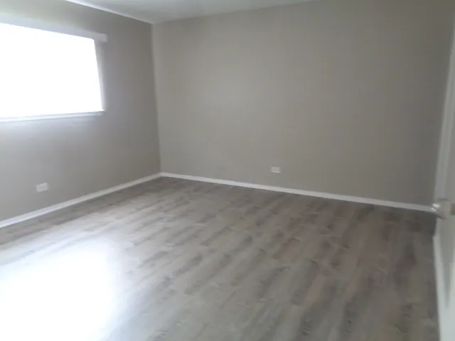 a bath room with a toilet sink and a bath tub