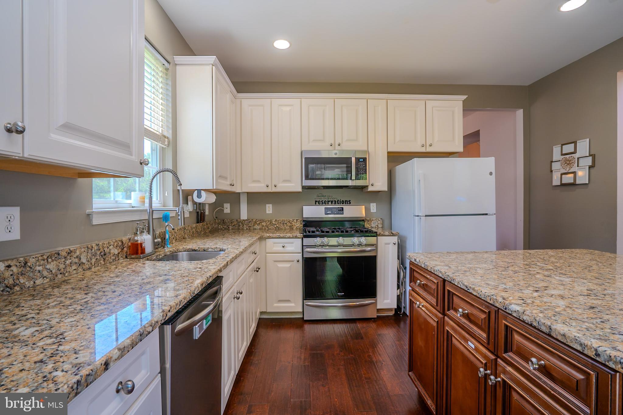 101 Beacon Drive Deptford, NJ 08096 - Photo 20 of 40 a kitchen with granite countertop a sink stove and refrigerator