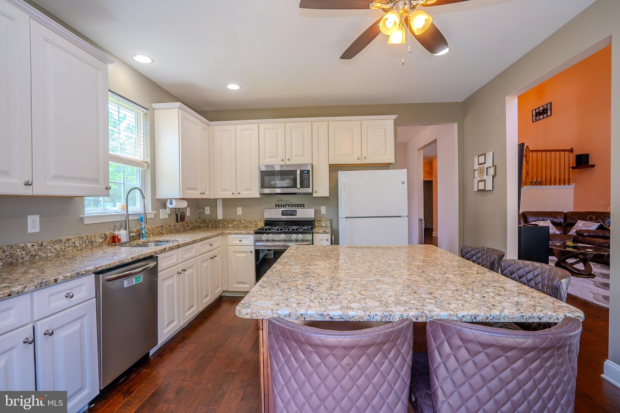 101 Beacon Drive Deptford, NJ 08096 - Photo 21 of 40 a kitchen with stainless steel appliances granite countertop a sink stove and refrigerator