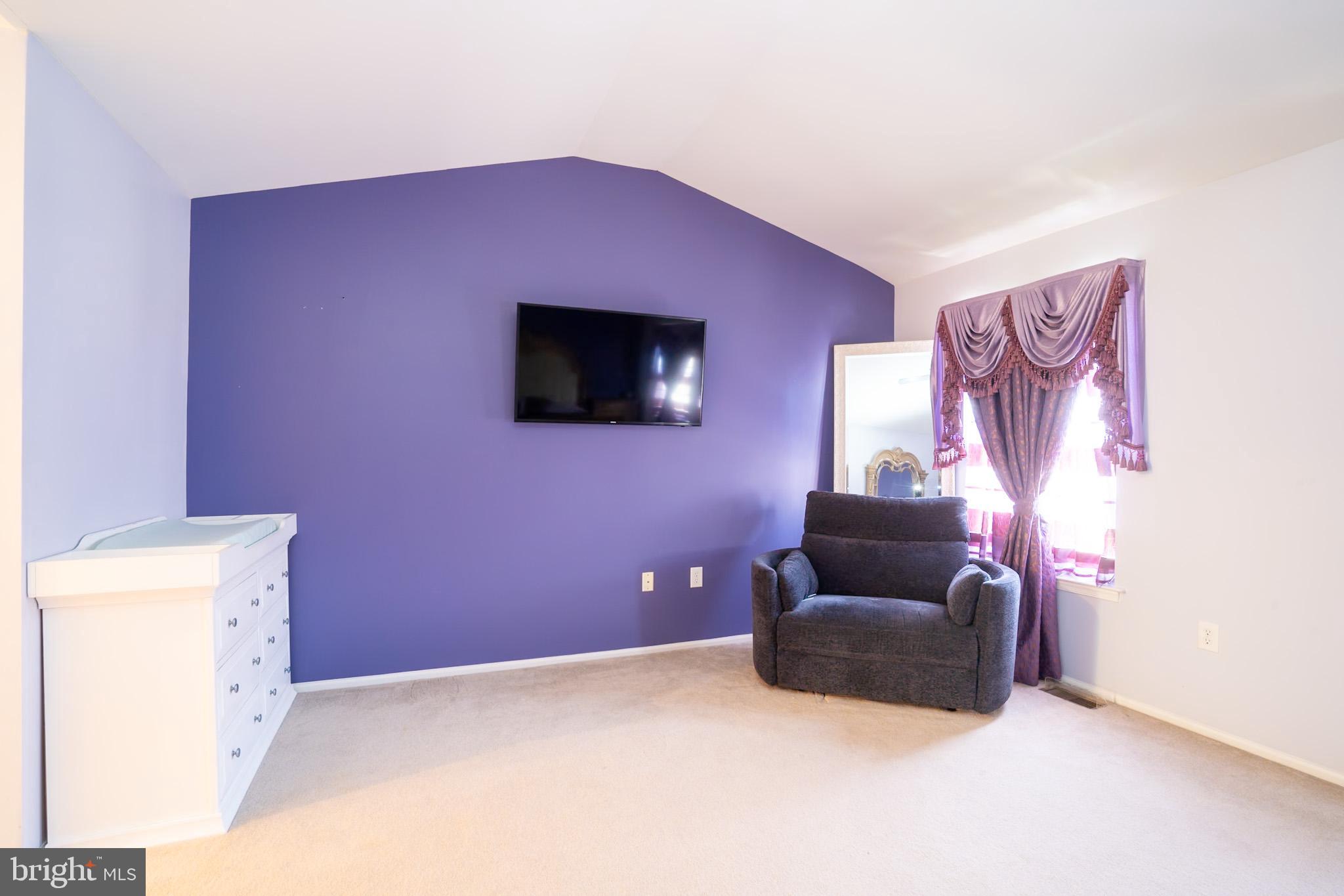 101 Beacon Drive Deptford, NJ 08096 - Photo 25 of 40 a living room with furniture and a flat screen tv