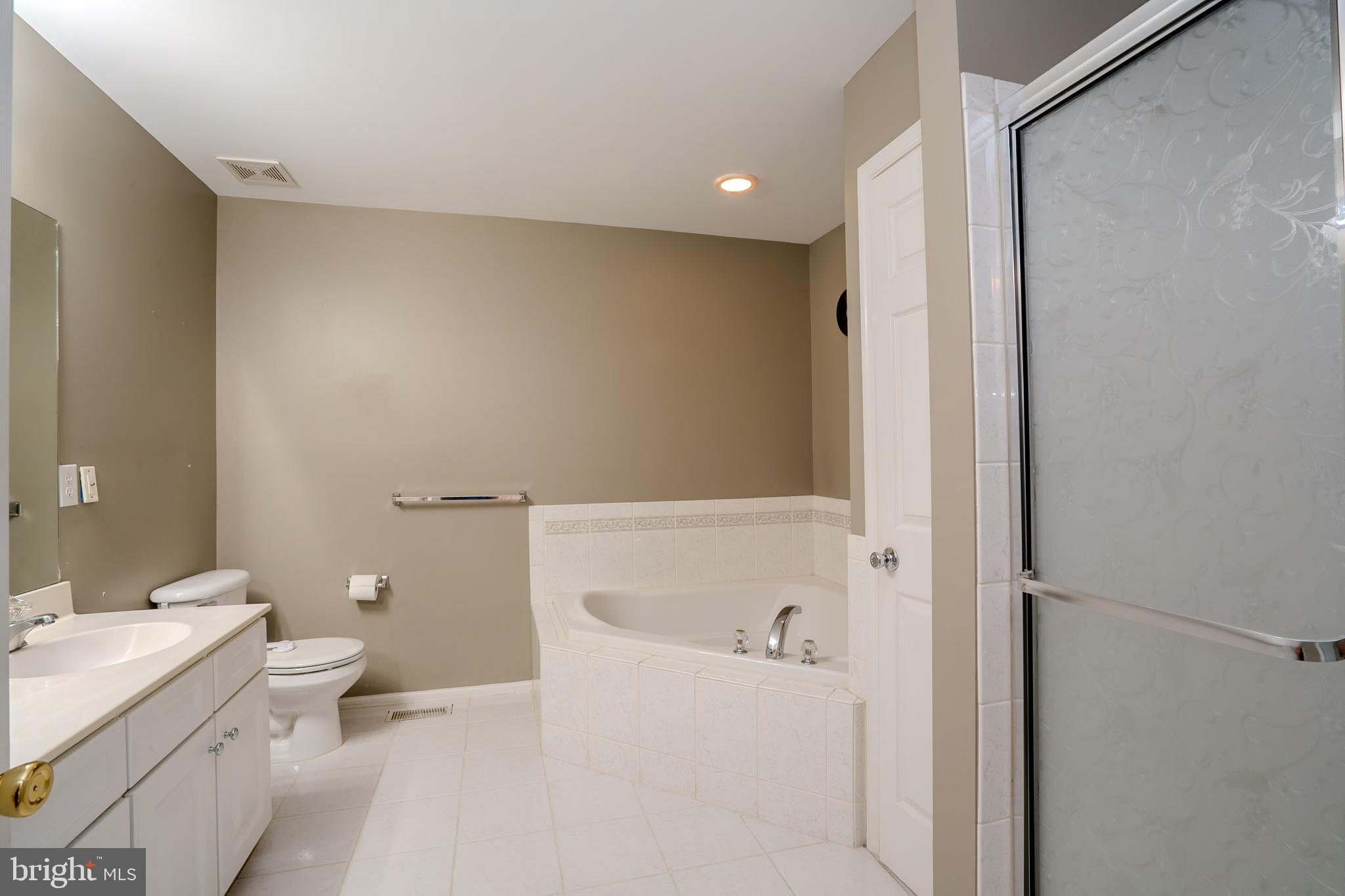 101 Beacon Drive Deptford, NJ 08096 - Photo 26 of 40 a bathroom with a sink a toilet and shower
