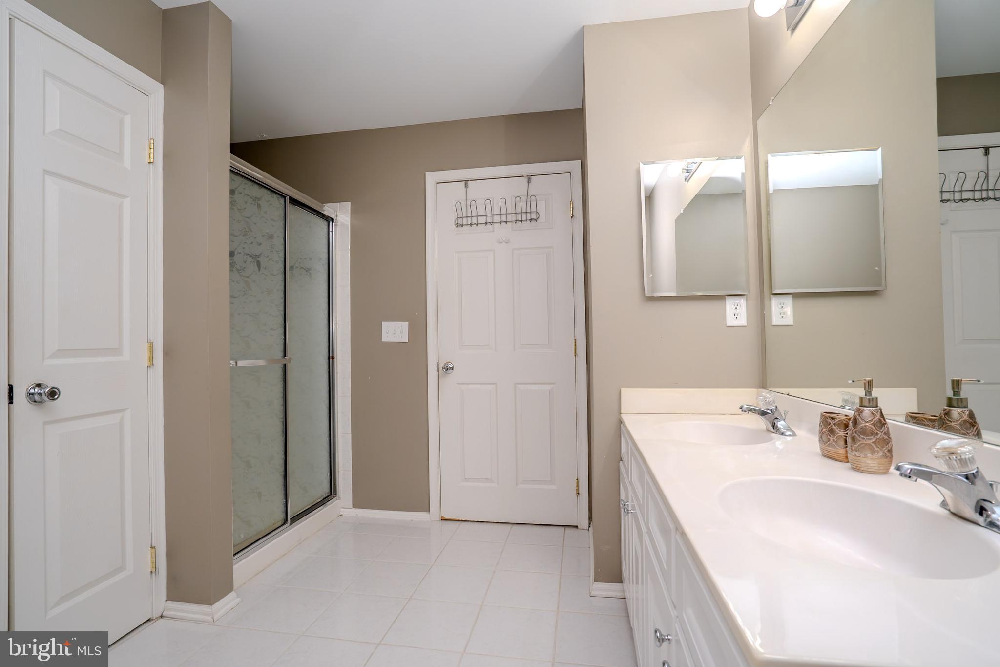 101 Beacon Drive Deptford, NJ 08096 - Photo 27 of 40 a bathroom with a sink and a mirror