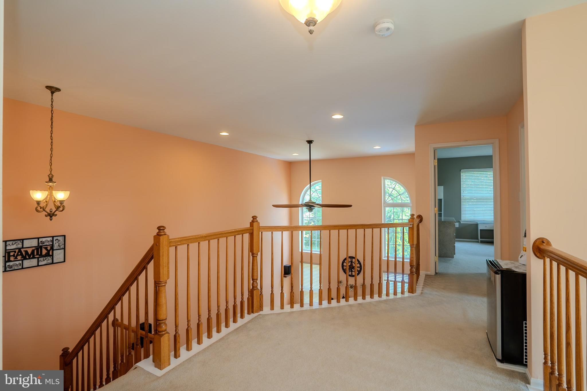 101 Beacon Drive Deptford, NJ 08096 - Photo 30 of 40 a view of staircase with railing and a chandelier