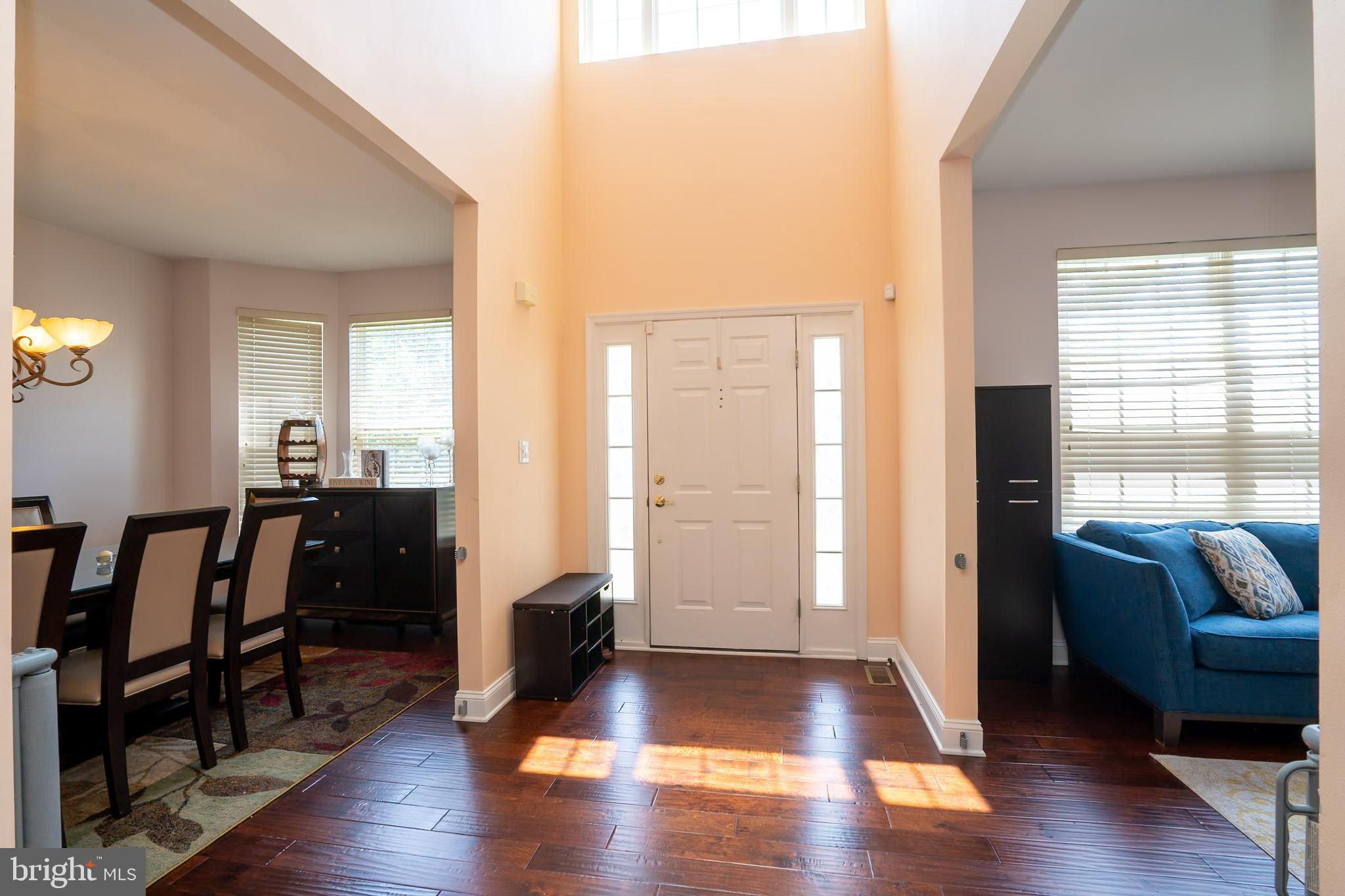 101 Beacon Drive Deptford, NJ 08096 - Photo 3 of 40 a view of a livingroom with furniture and hardwood floor