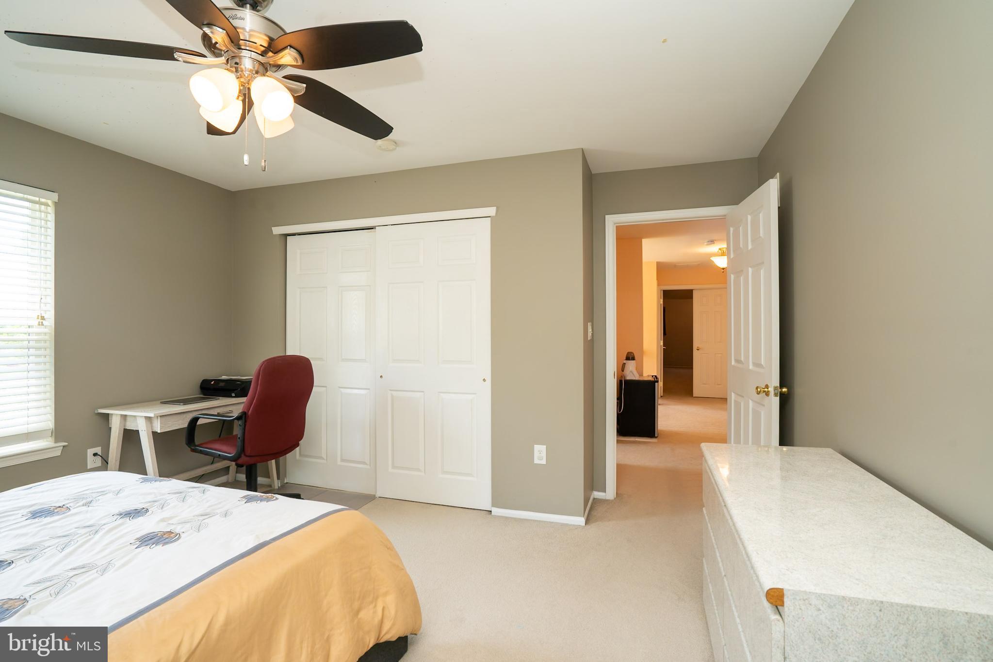 101 Beacon Drive Deptford, NJ 08096 - Photo 33 of 40 a bedroom with a bed and a chair