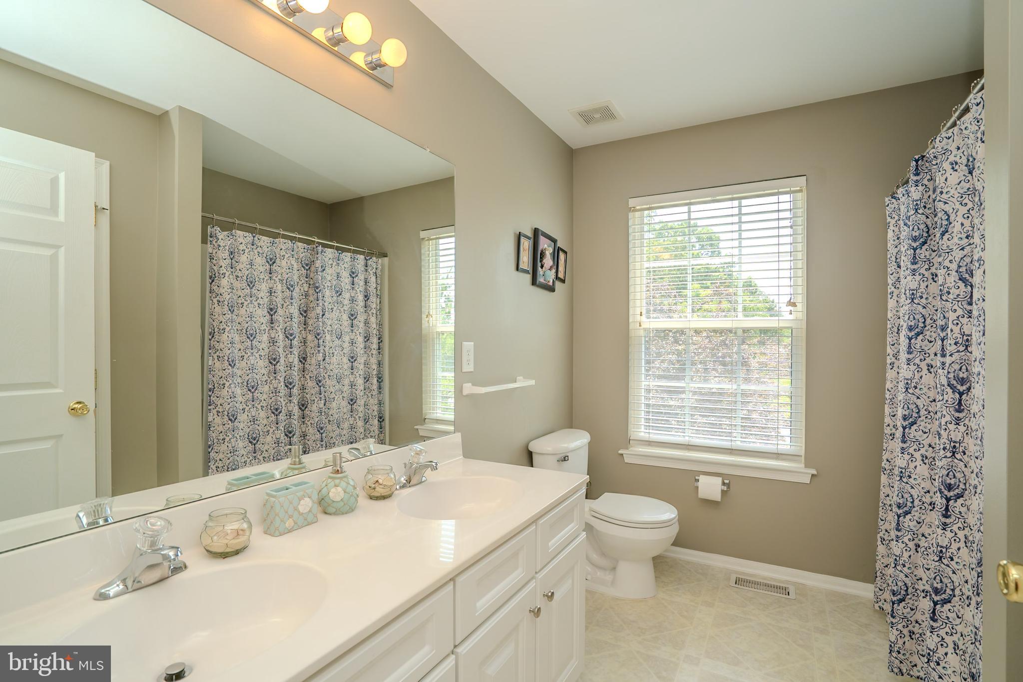 101 Beacon Drive Deptford, NJ 08096 - Photo 34 of 40 a bathroom with a sink toilet and shower