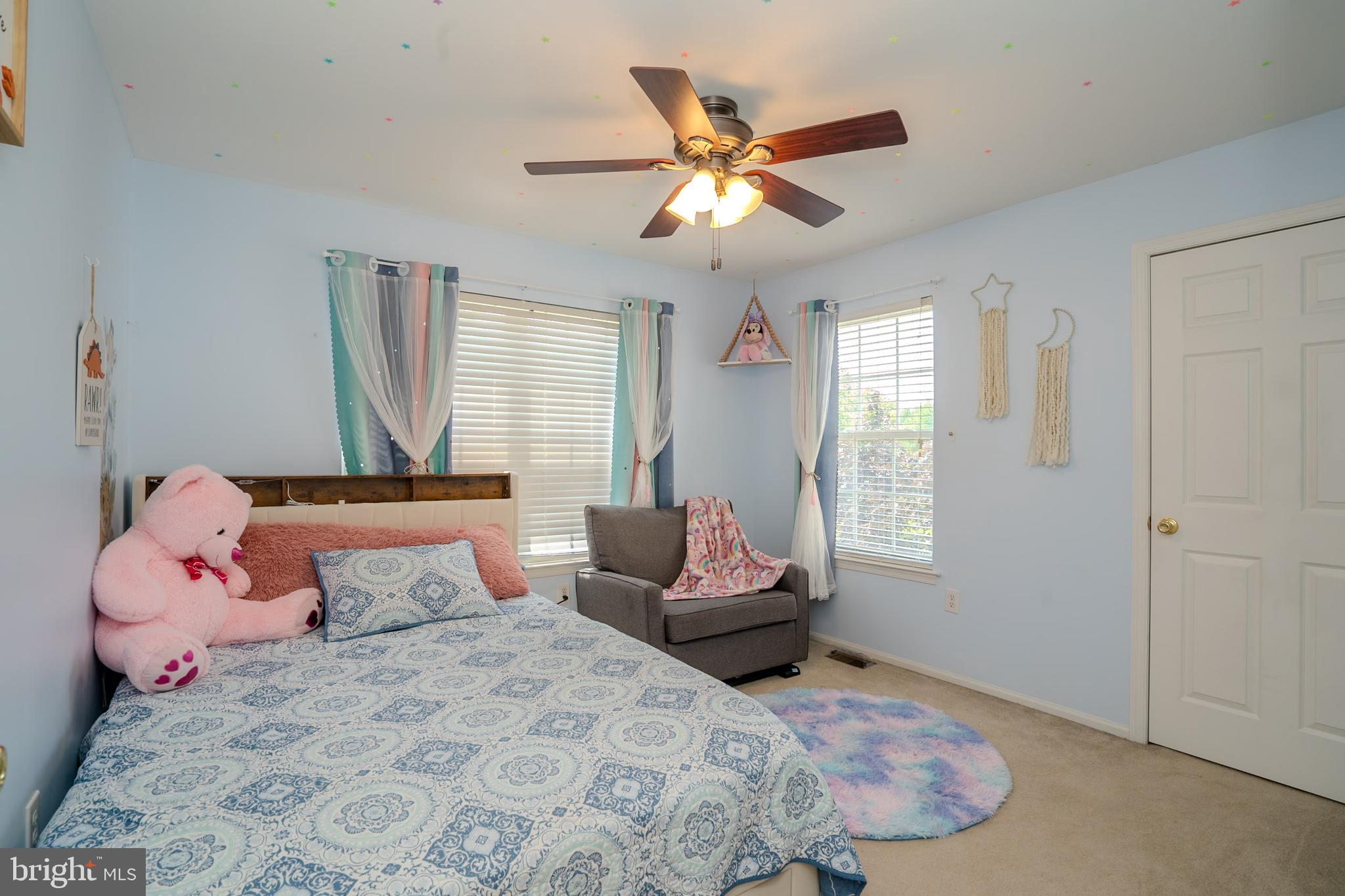 101 Beacon Drive Deptford, NJ 08096 - Photo 35 of 40 a bedroom with a bed and wooden floor