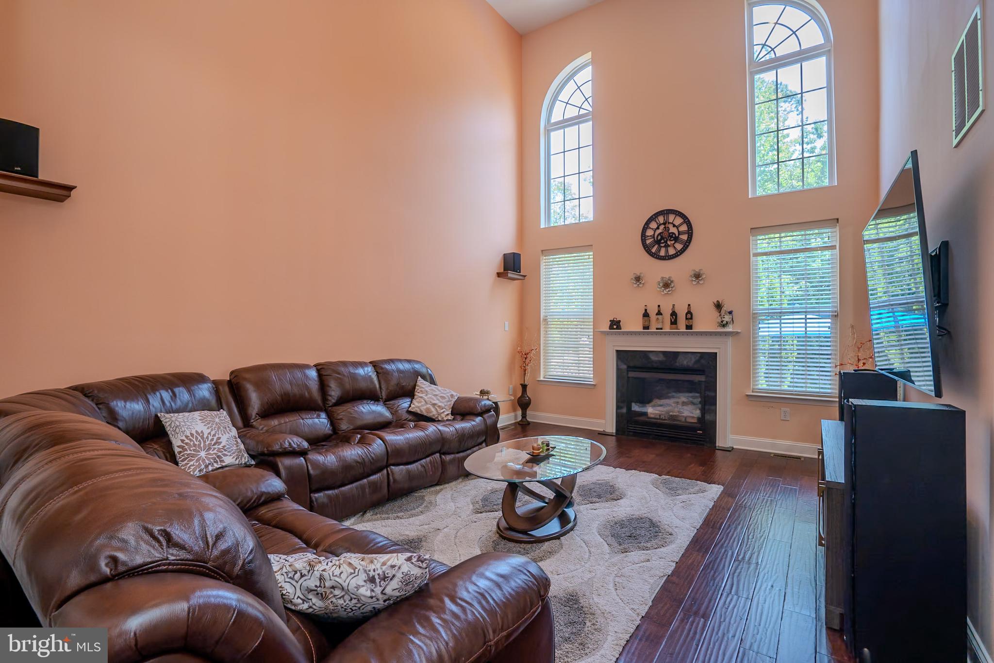 101 Beacon Drive Deptford, NJ 08096 - Photo 4 of 40 a living room with furniture and a fireplace