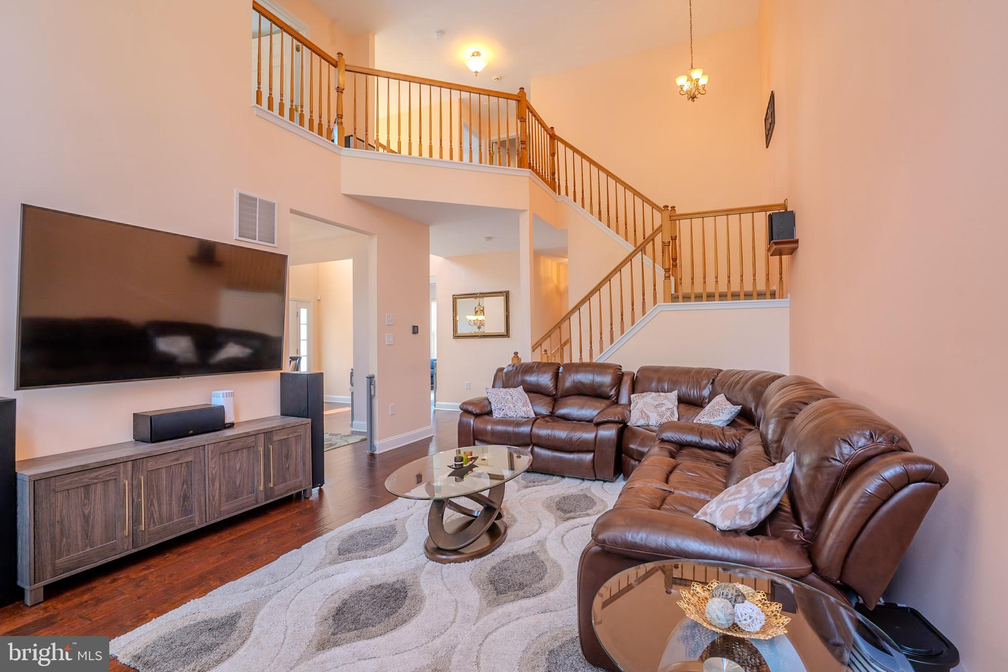 101 Beacon Drive Deptford, NJ 08096 - Photo 5 of 40 a living room with furniture and a flat screen tv