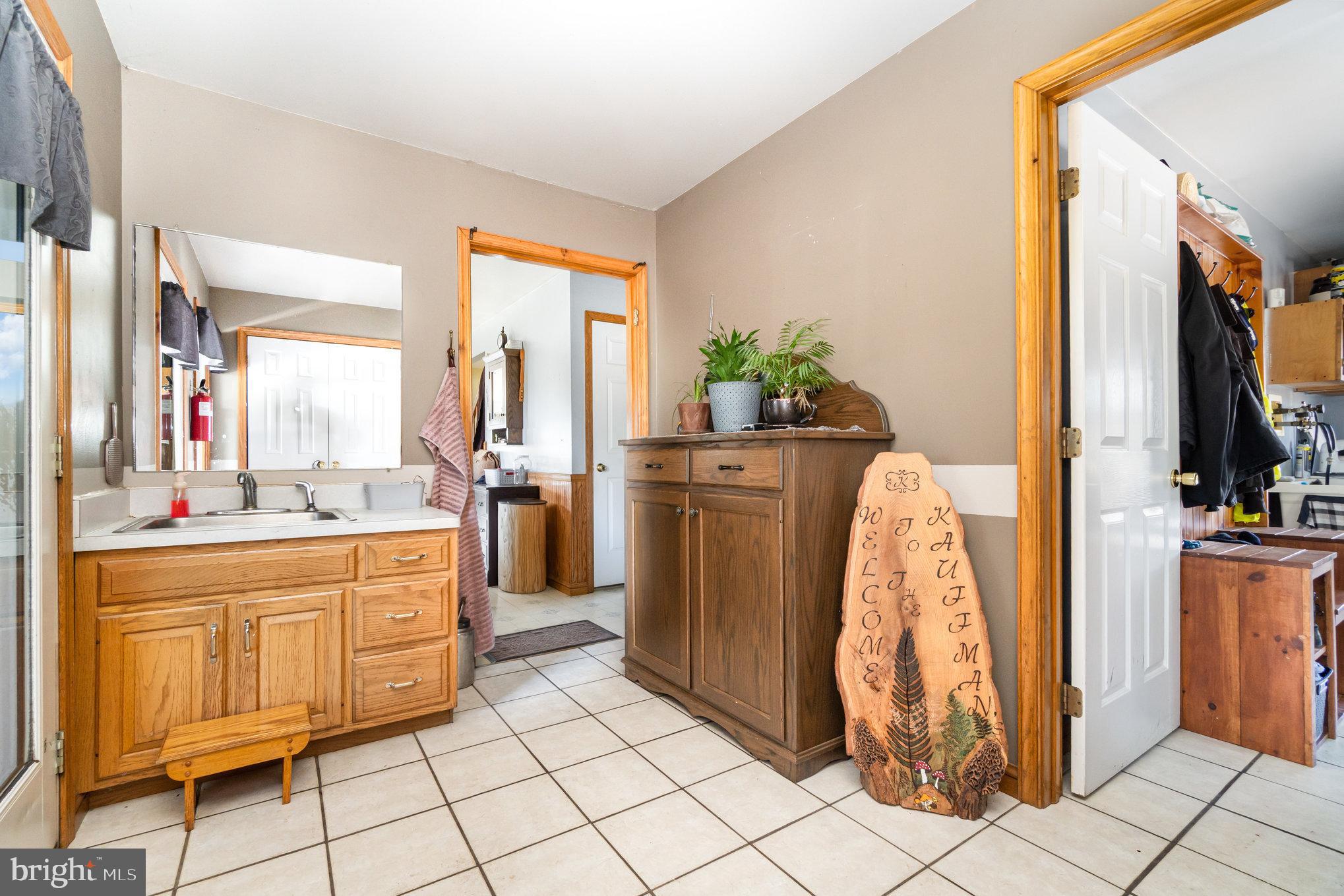 72 Quigley Road Newburg, PA 17240 - Photo 15 of 69 a view of kitchen with stainless steel appliances kitchen island granite countertop cabinets and a window