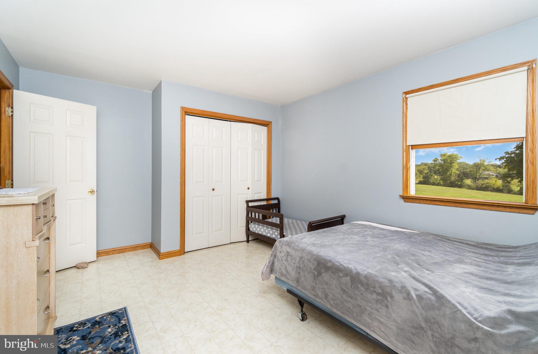 72 Quigley Road Newburg, PA 17240 - Photo 21 of 69 a bedroom with a bed and a window with chair