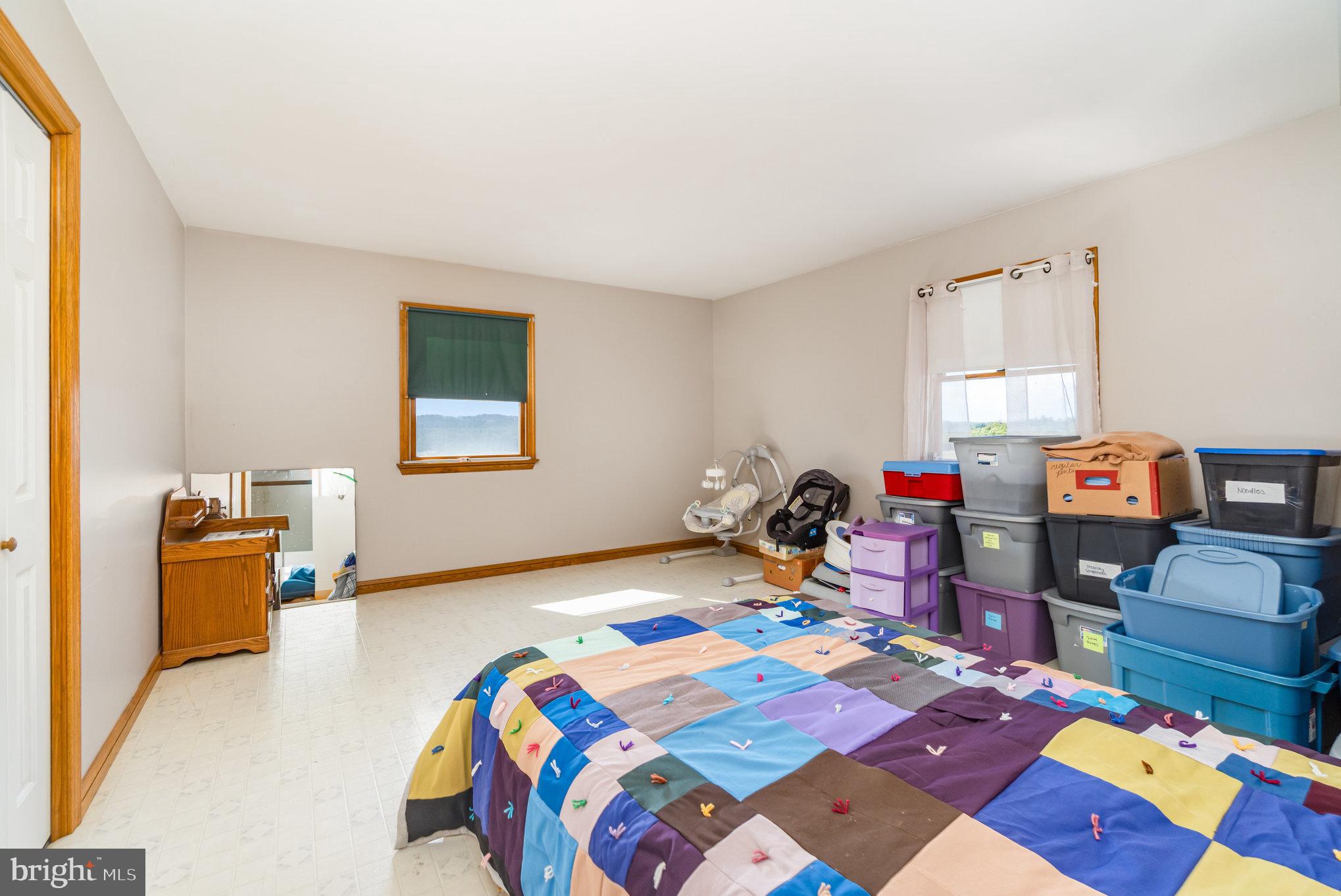 72 Quigley Road Newburg, PA 17240 - Photo 24 of 69 a bedroom that has a bed and a table in it