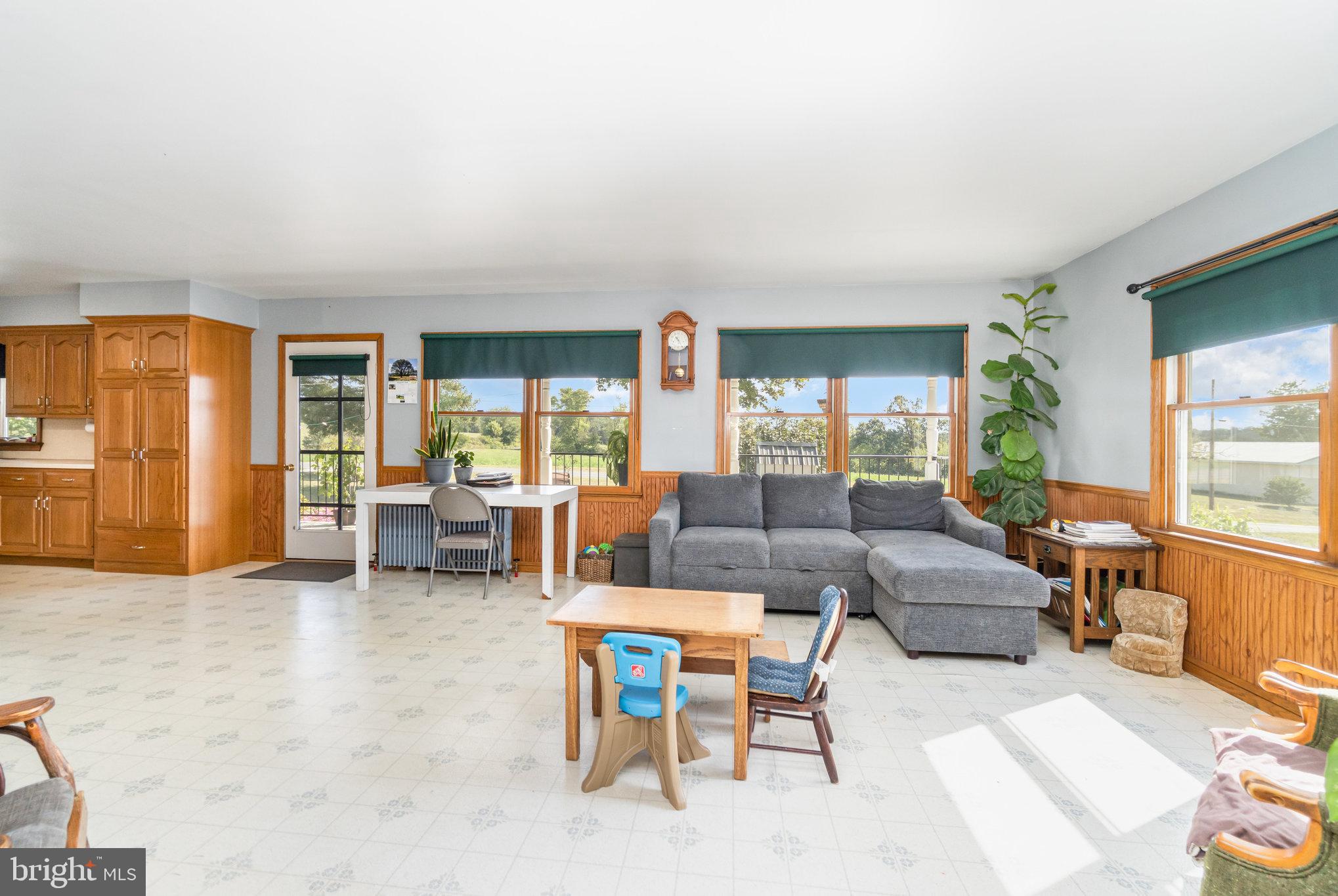 72 Quigley Road Newburg, PA 17240 - Photo 3 of 69 a living room with fireplace furniture and large windows