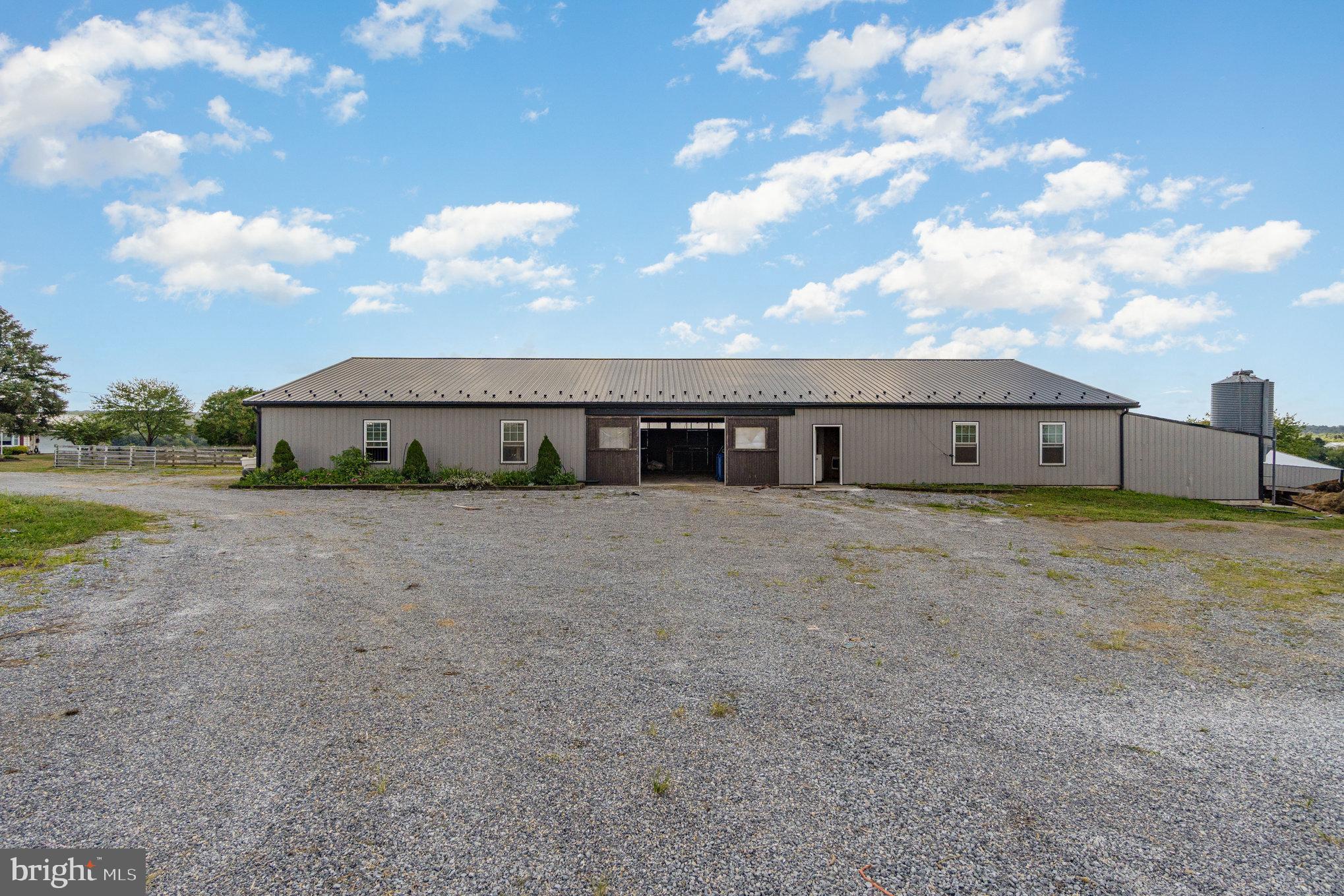 72 Quigley Road Newburg, PA 17240 - Photo 38 of 69 a front view of a house with a yard and garage