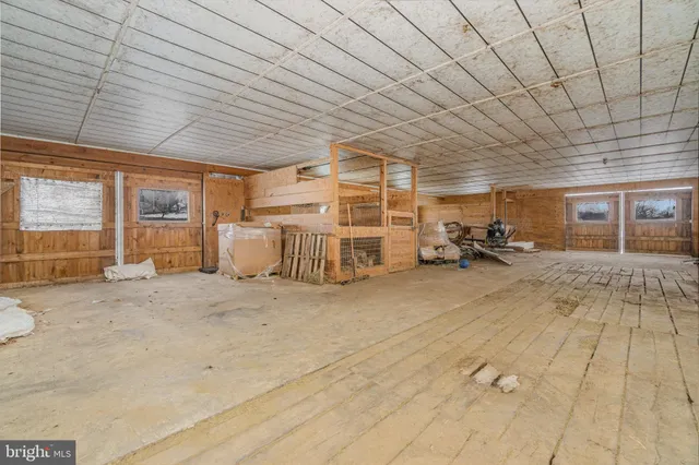 a view of yard with swimming pool and trees