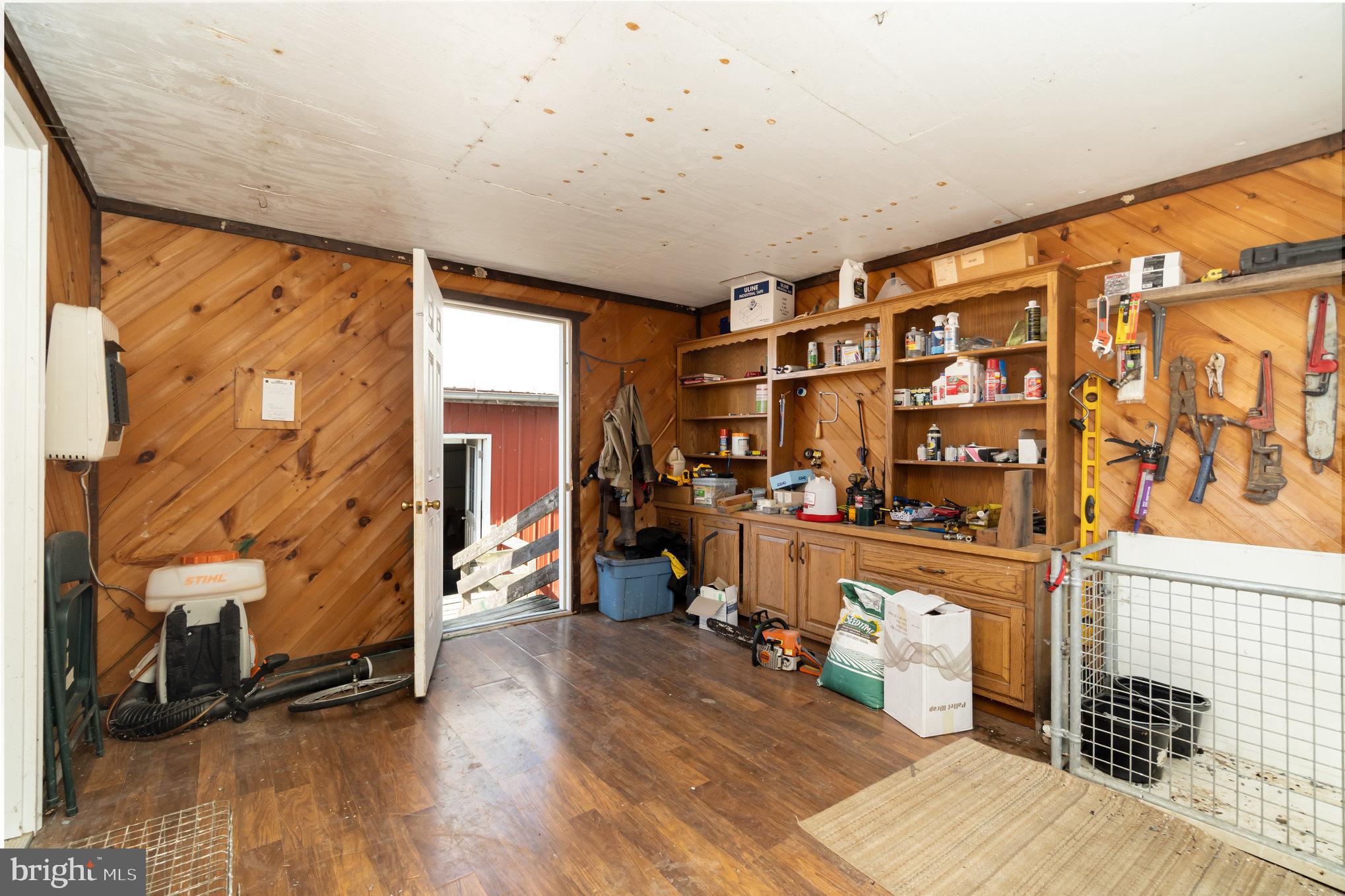 72 Quigley Road Newburg, PA 17240 - Photo 60 of 69 a living room with furniture a wooden floor and next to a window