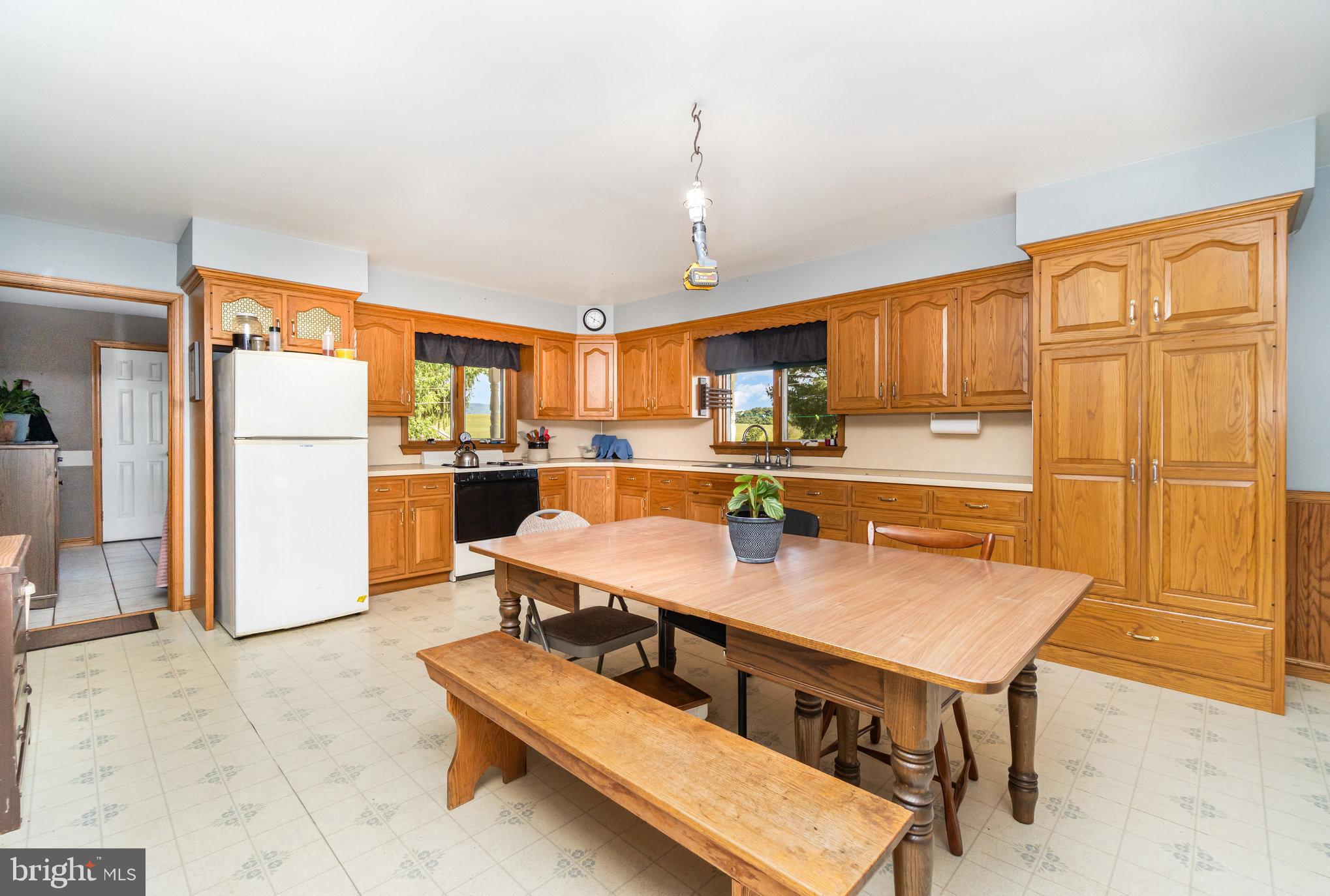 72 Quigley Road Newburg, PA 17240 - Photo 6 of 69 a kitchen with kitchen island a counter top space appliances and cabinets