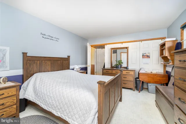 a bedroom with a bed and furniture