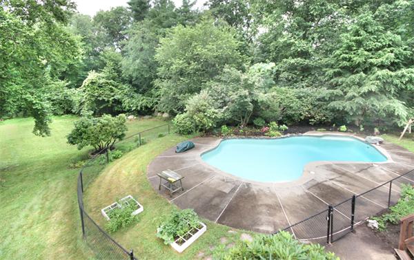 64 Cedar Street Walpole, MA 02081 - Photo 18 of 28 a view of a swimming pool with a yard