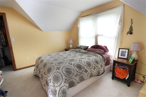 64 Cedar Street Walpole, MA 02081 - Photo 20 of 28 a bedroom with a bed and a window