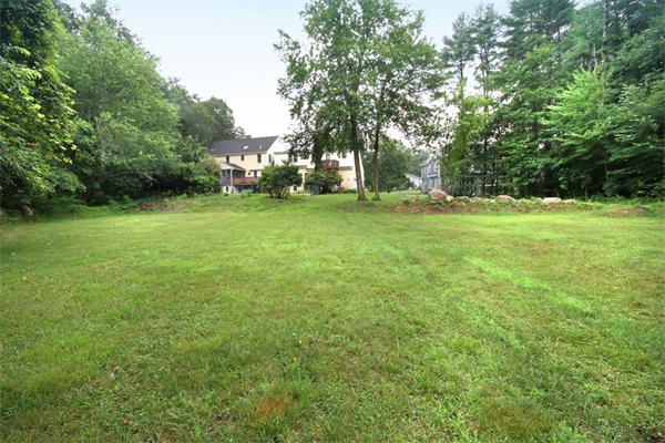 64 Cedar Street Walpole, MA 02081 - Photo 27 of 28 a view of a field of grass and trees