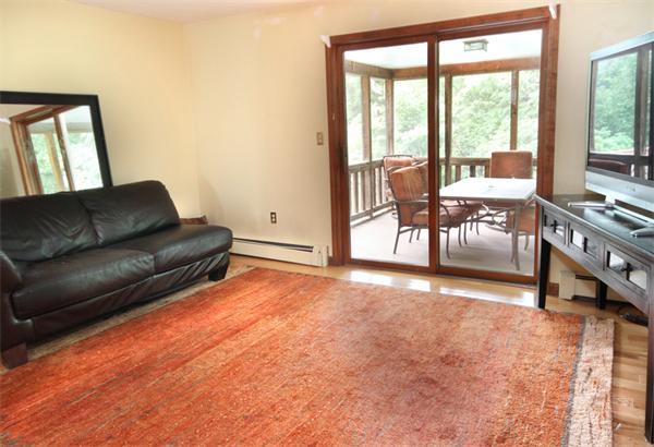 64 Cedar Street Walpole, MA 02081 - Photo 6 of 28 a living room with furniture and a large window