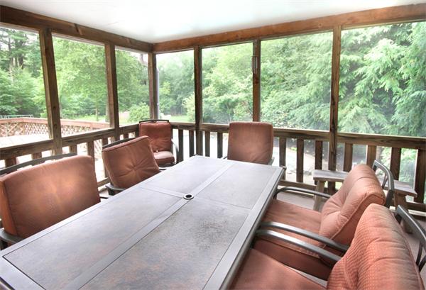 64 Cedar Street Walpole, MA 02081 - Photo 7 of 28 a balcony with furniture and large windows