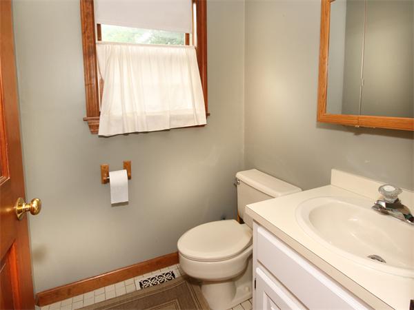 64 Cedar Street Walpole, MA 02081 - Photo 9 of 28 a bathroom with a sink and a toilet